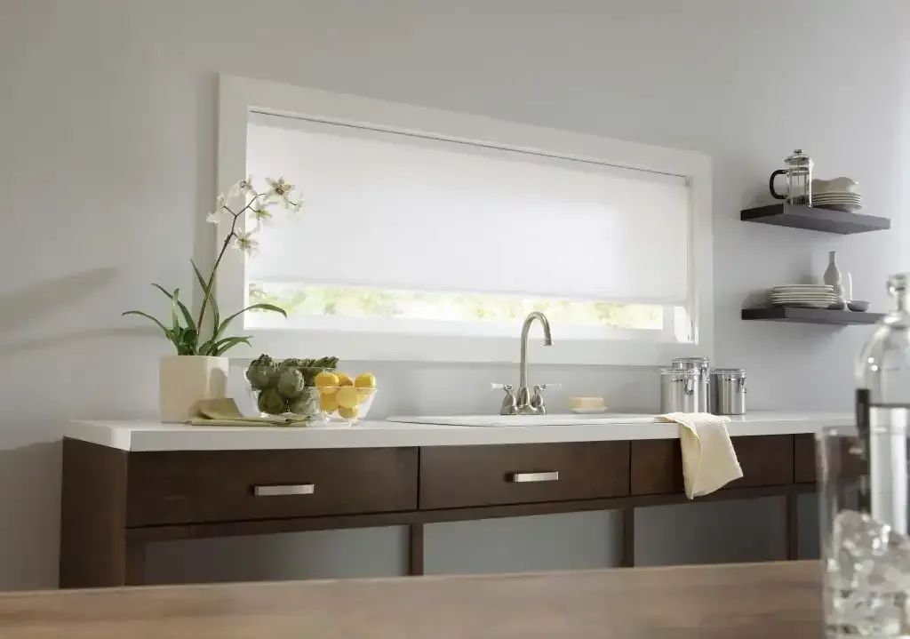 Kitchen with dark wood cabinets, floating shelves, and a white cellular shade over the sink window