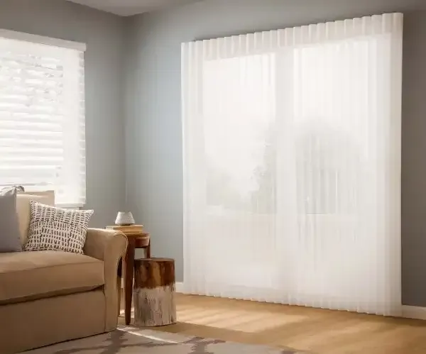 Living room sliding door covered with sheer vertical shades