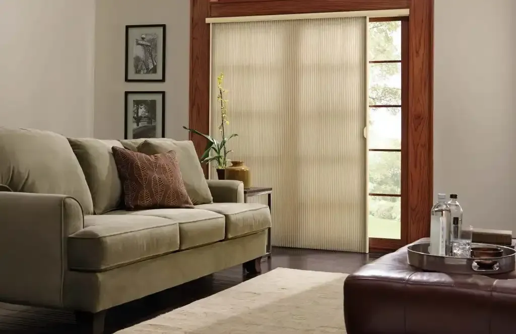 Living room patio door covered with vertical cellular shades